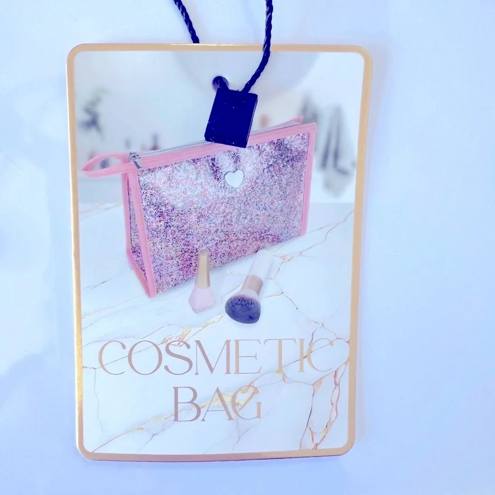 Pink Glitter Cosmetic Bag with a Silver Heart on Clear Vinyl & a Silver Zipper.